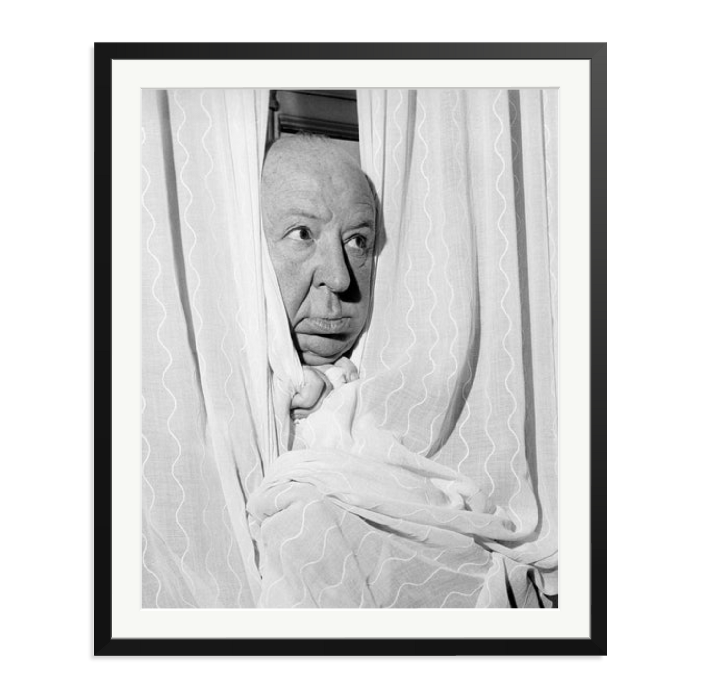 Alfred Hitchcock at the Claridges Hotel Framed Print