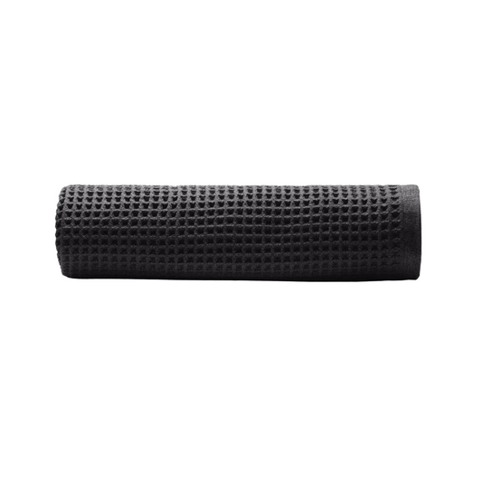 Casamera Charcoal bath towel rolled on white background