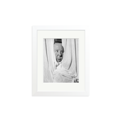 Alfred Hitchcock at the Claridges Hotel Framed Print