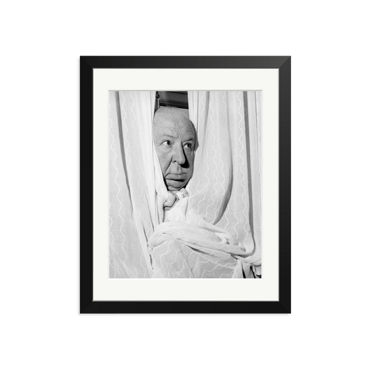Alfred Hitchcock at the Claridges Hotel Framed Print