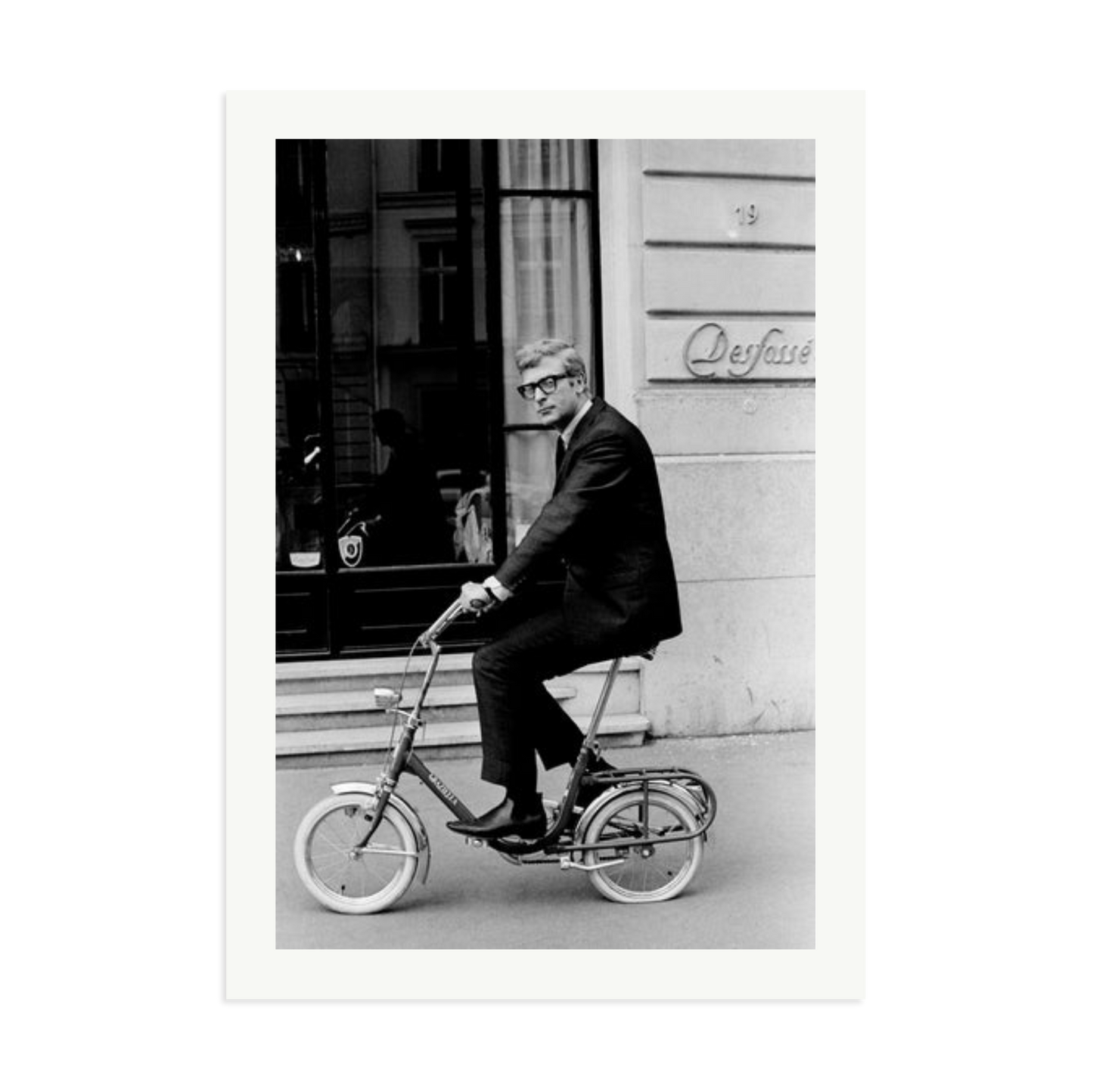 Michael Caine on His Bike Framed Print