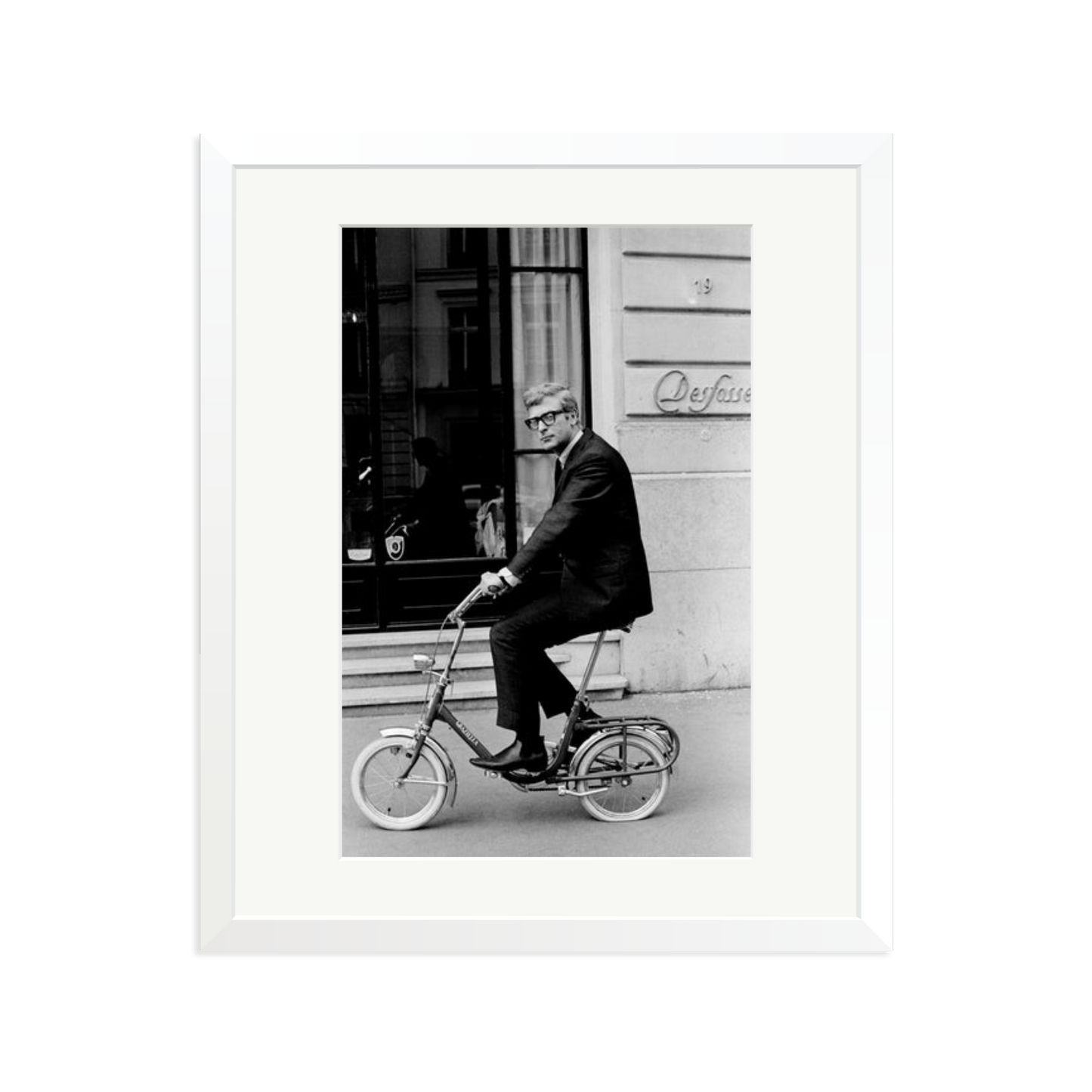 Michael Caine on His Bike Framed Print