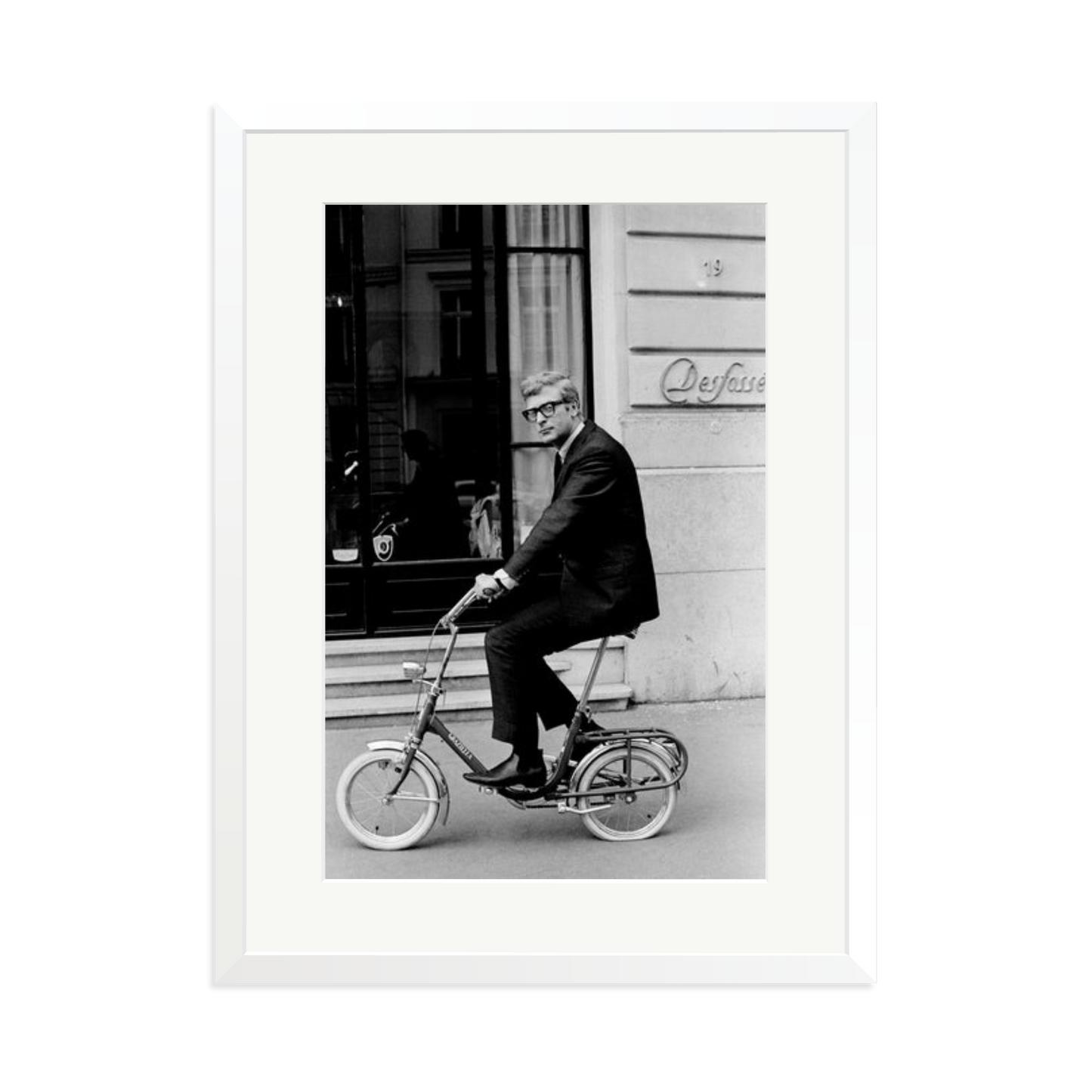 Michael Caine on His Bike Framed Print