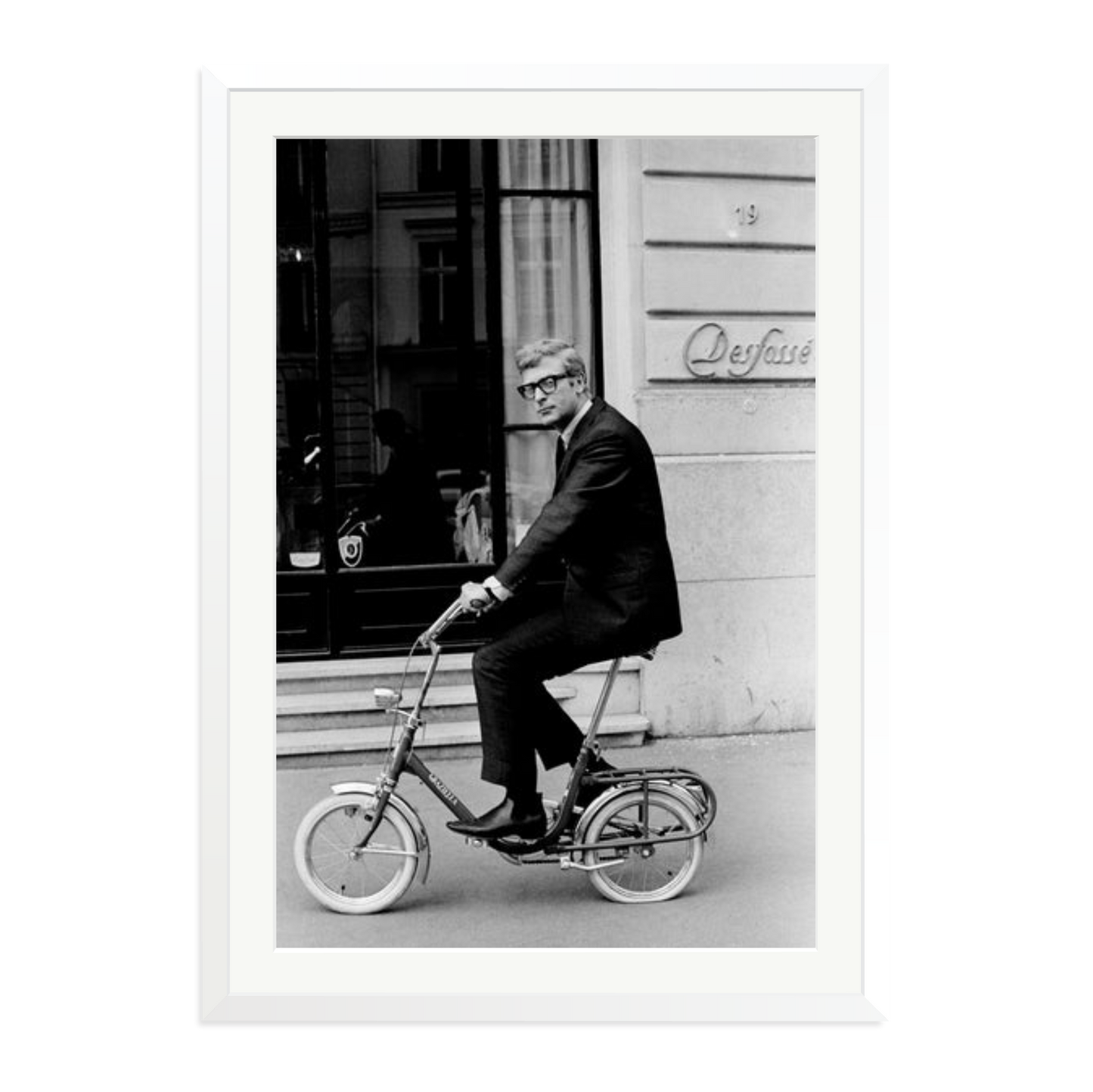 Michael Caine on His Bike Framed Print