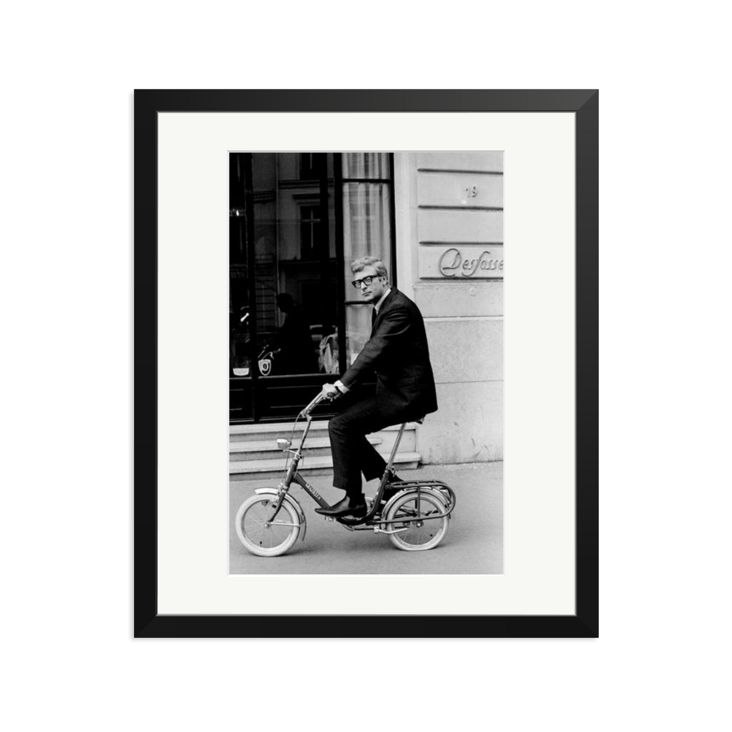 Michael Caine on His Bike Framed Print