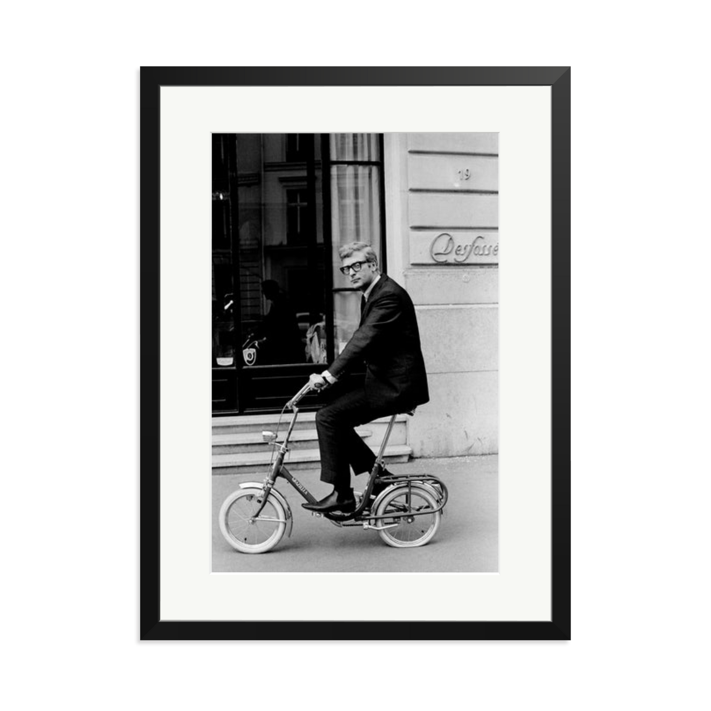 Michael Caine on His Bike Framed Print