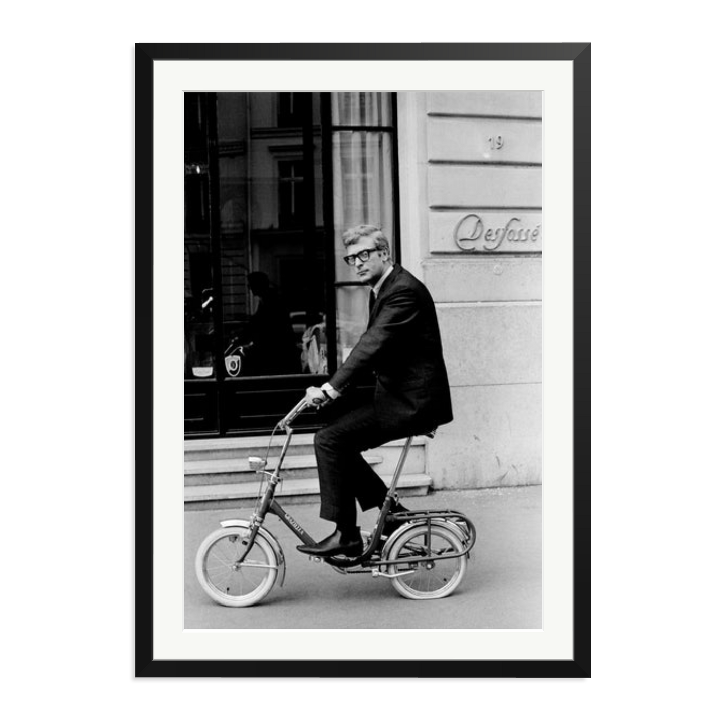Michael Caine on His Bike Framed Print