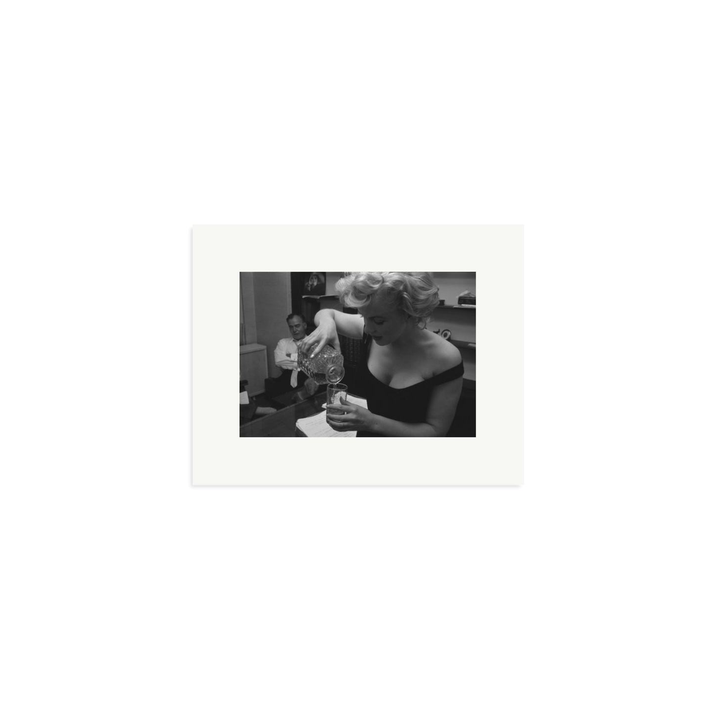 Marilyn Monroe Pouring A Drink Framed Print