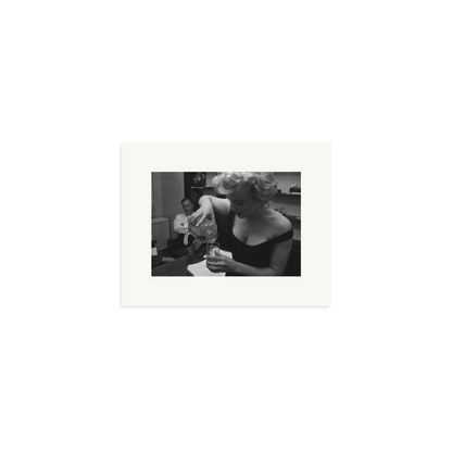 Marilyn Monroe Pouring A Drink Framed Print