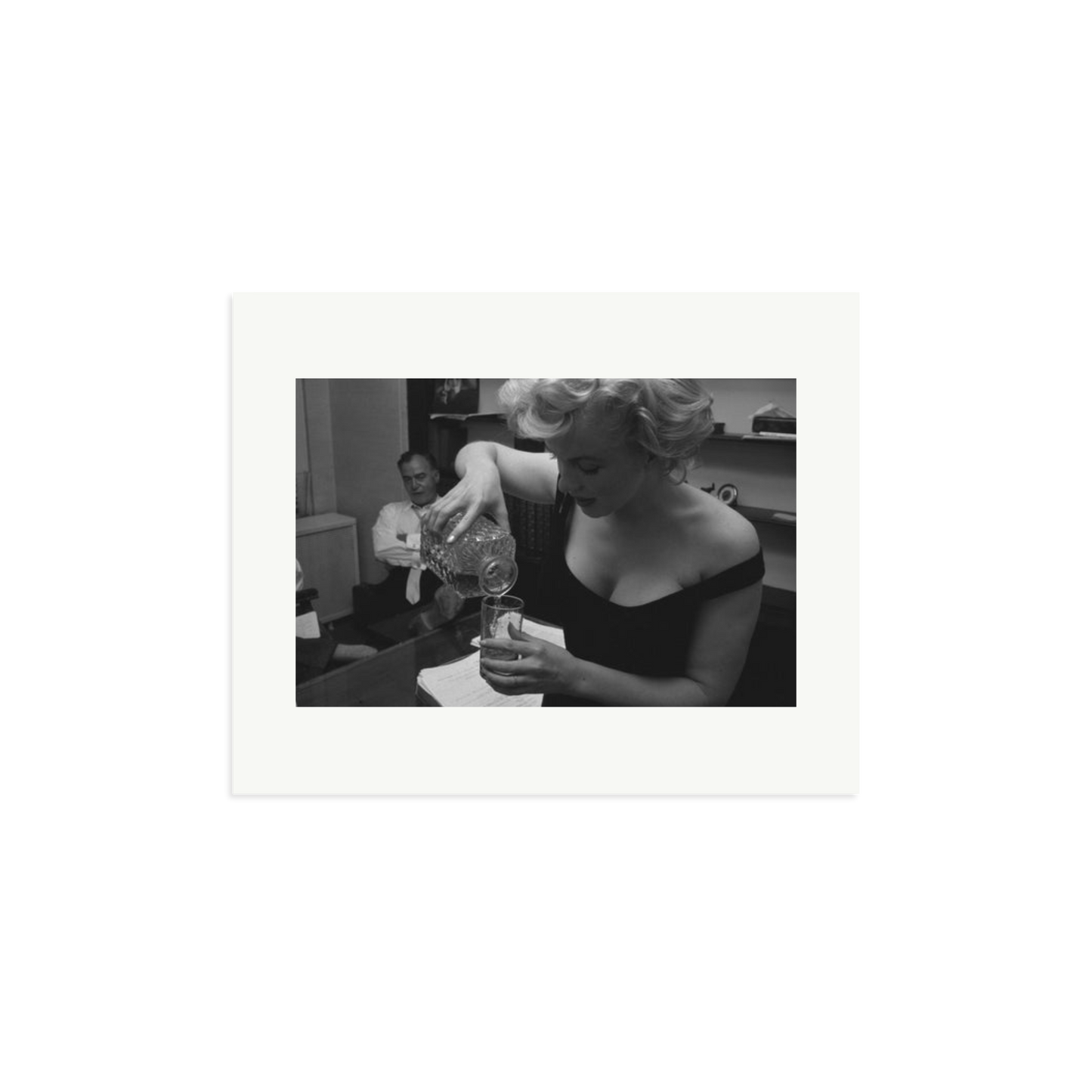 Marilyn Monroe Pouring A Drink Framed Print