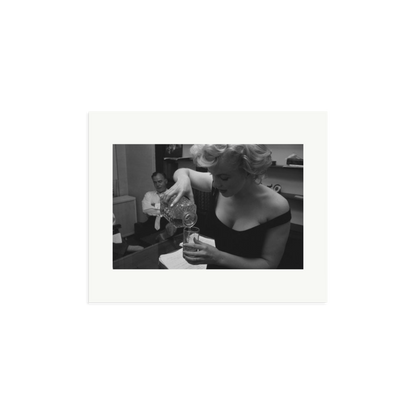 Marilyn Monroe Pouring A Drink Framed Print