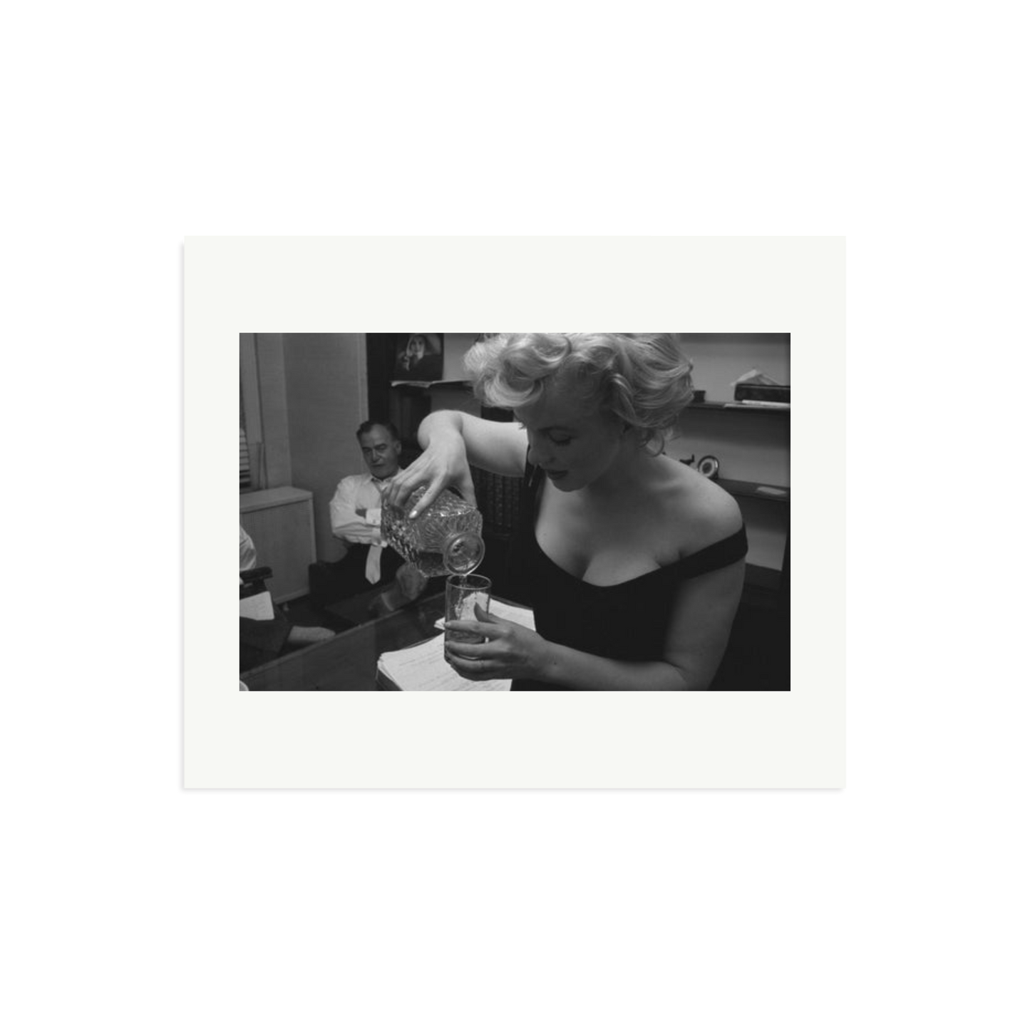 Marilyn Monroe Pouring A Drink Framed Print