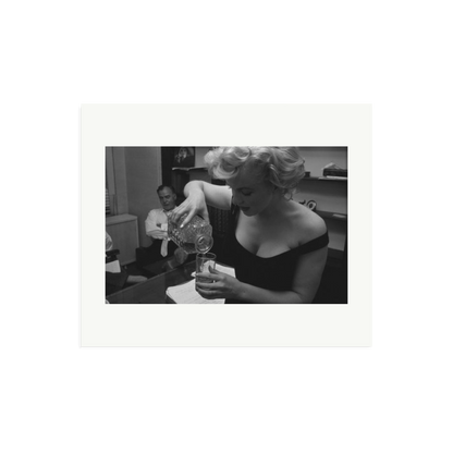 Marilyn Monroe Pouring A Drink Framed Print
