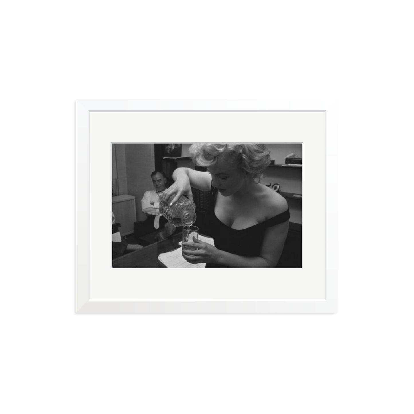 Marilyn Monroe Pouring A Drink Framed Print
