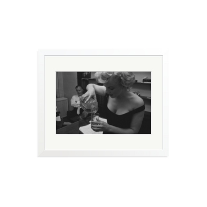 Marilyn Monroe Pouring A Drink Framed Print