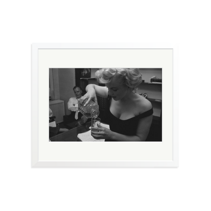 Marilyn Monroe Pouring A Drink Framed Print