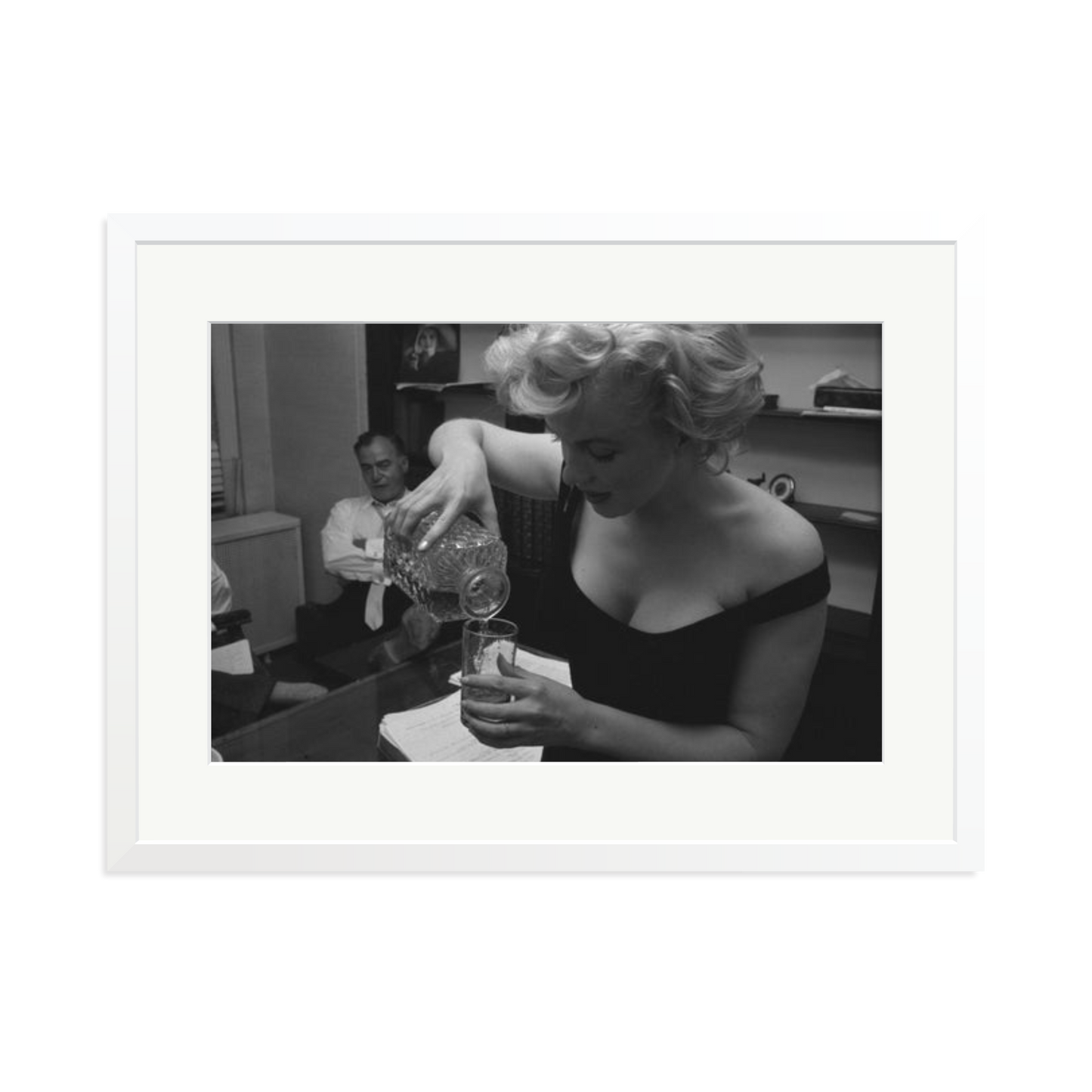 Marilyn Monroe Pouring A Drink Framed Print