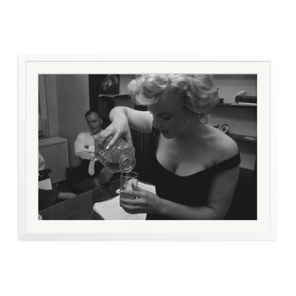 Marilyn Monroe Pouring A Drink Framed Print