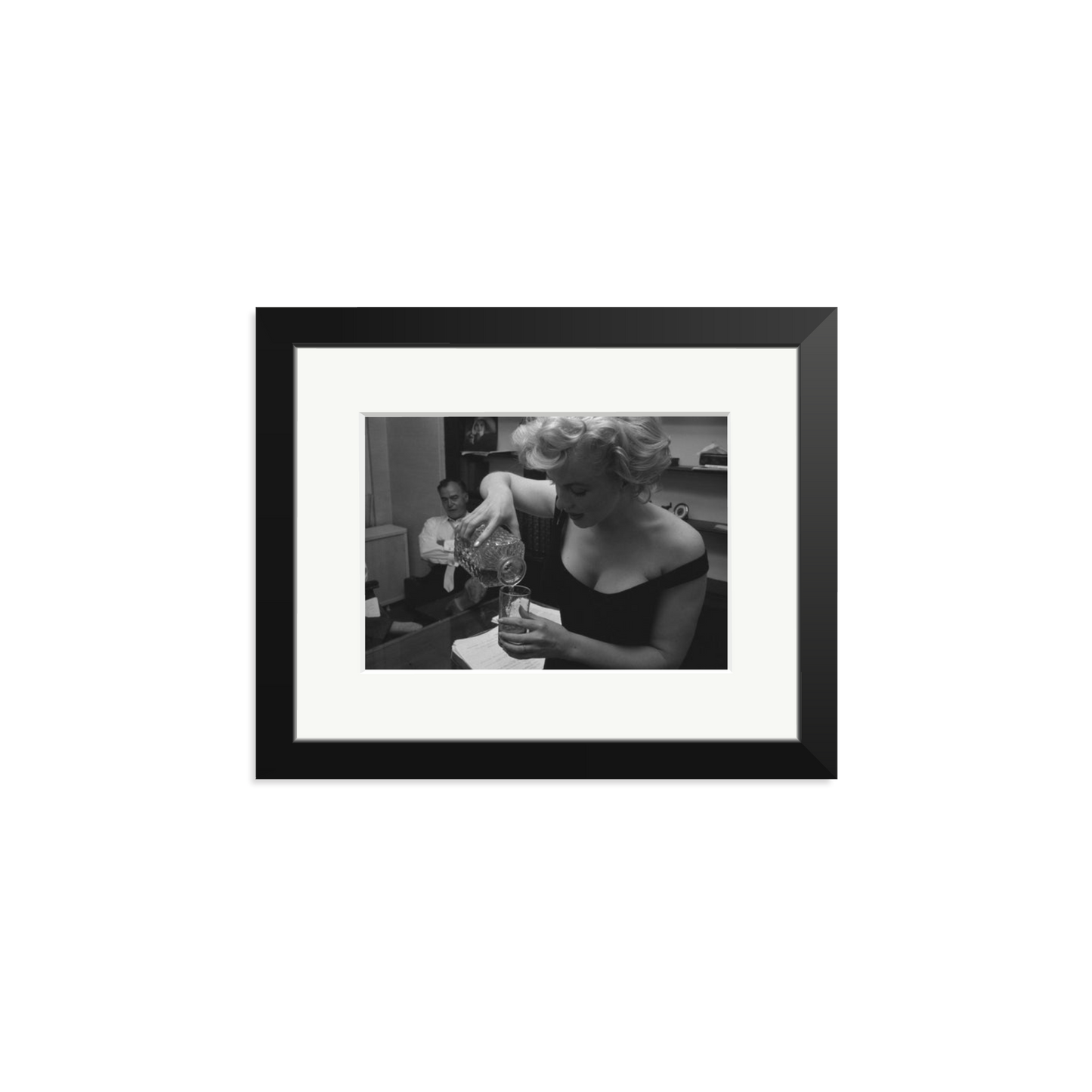 Marilyn Monroe Pouring A Drink Framed Print