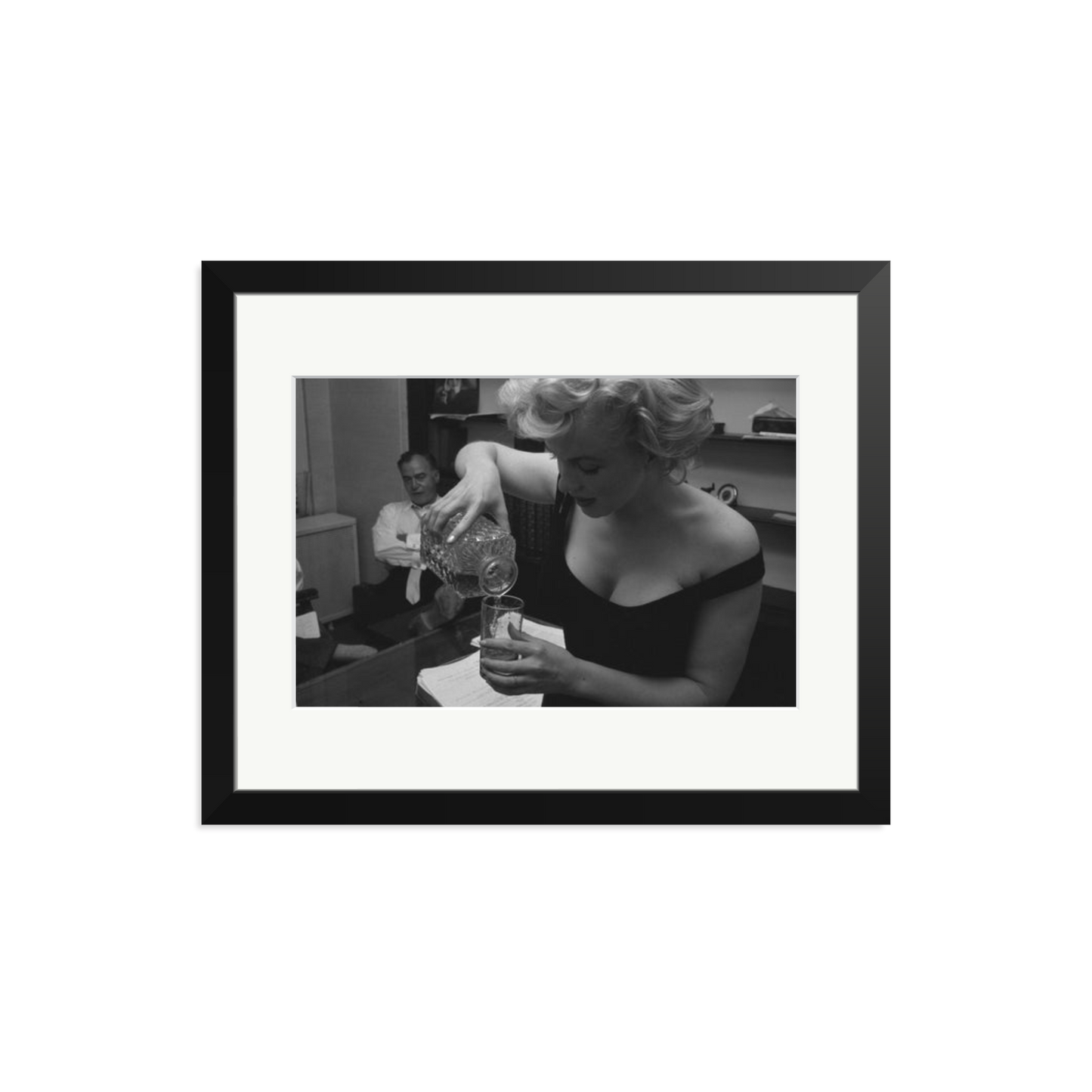 Marilyn Monroe Pouring A Drink Framed Print