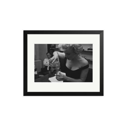 Marilyn Monroe Pouring A Drink Framed Print
