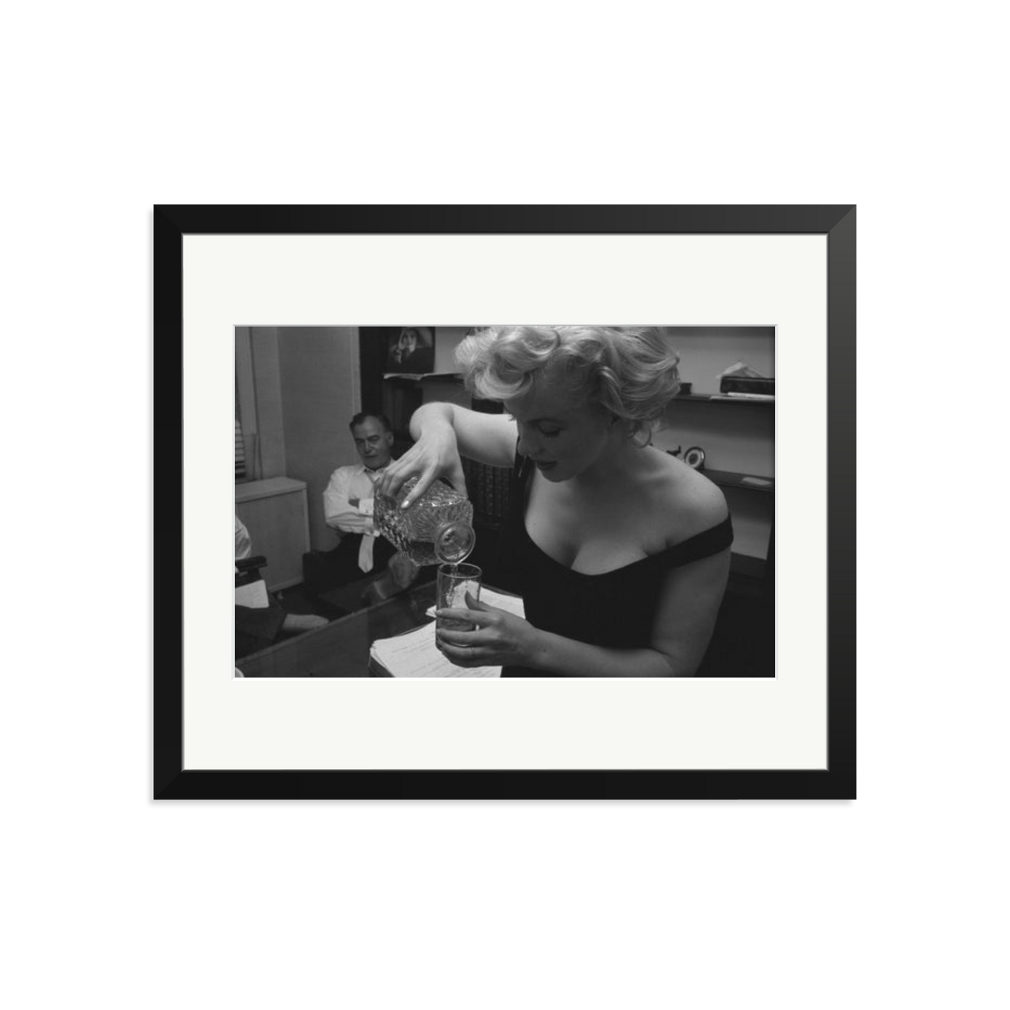 Marilyn Monroe Pouring A Drink Framed Print