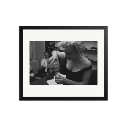 Marilyn Monroe Pouring A Drink Framed Print