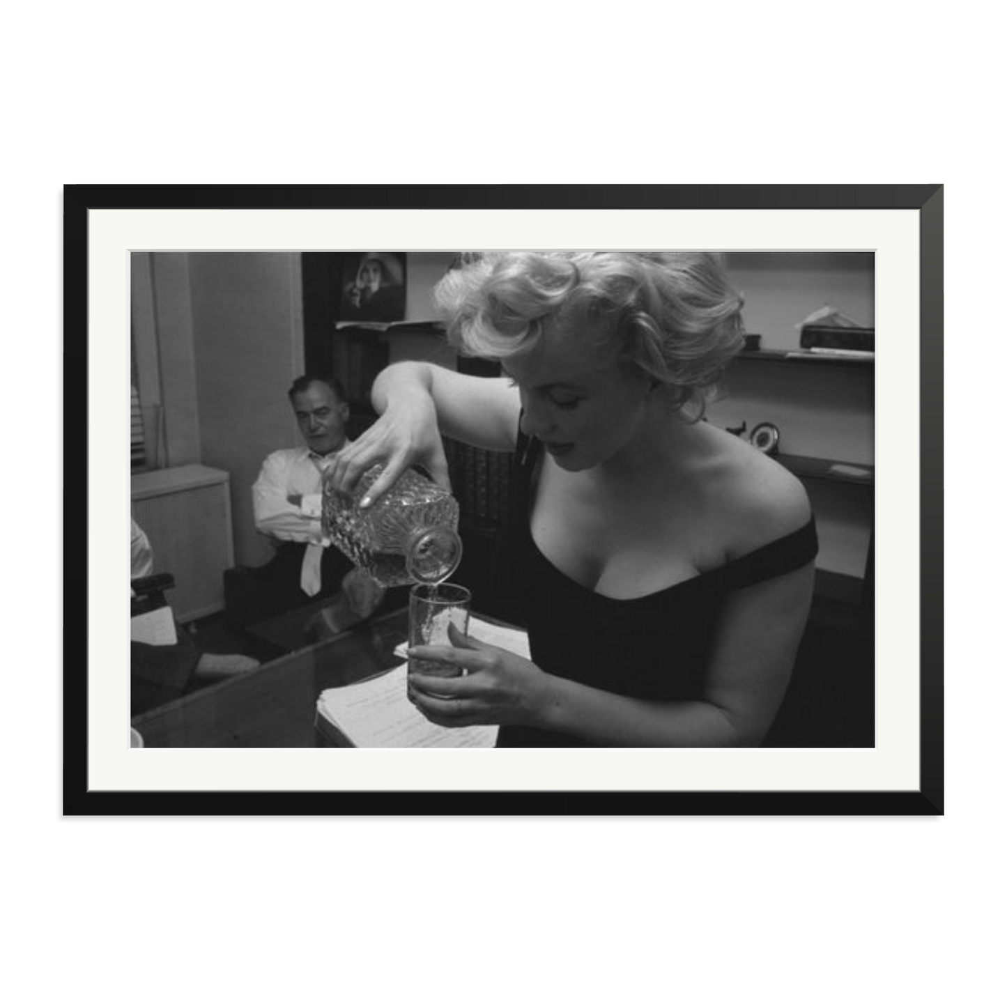 Marilyn Monroe Pouring A Drink Framed Print