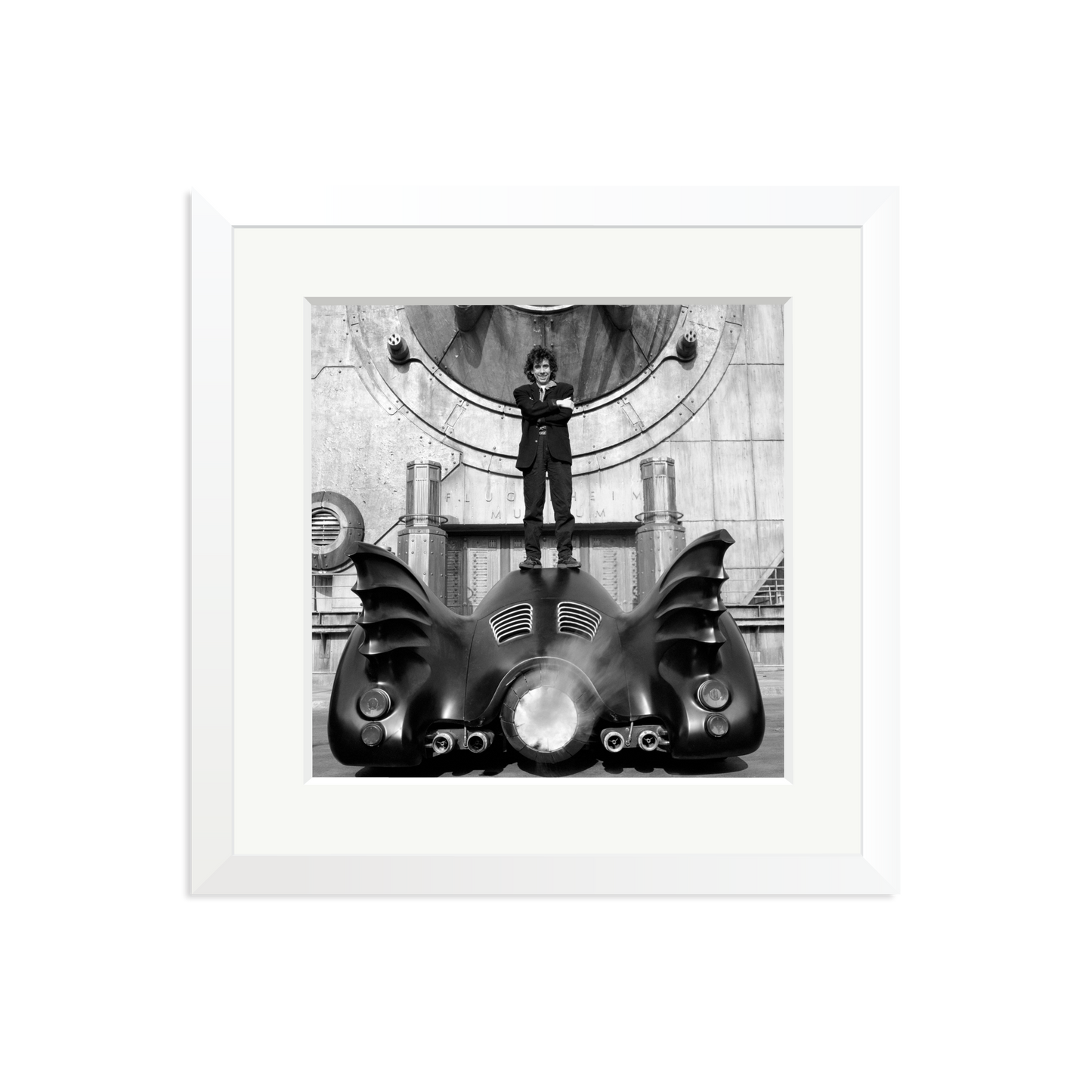 Tim Burton on The Batmobile Framed Print