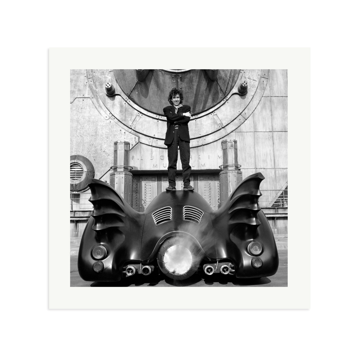 Tim Burton on The Batmobile Framed Print