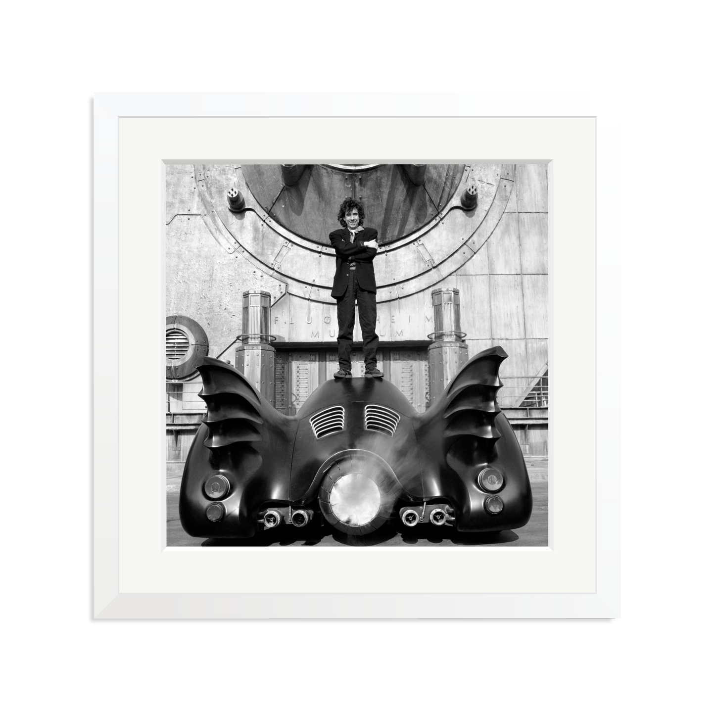 Tim Burton on The Batmobile Framed Print