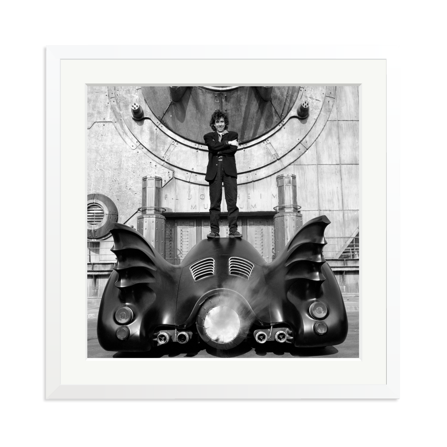 Tim Burton on The Batmobile Framed Print