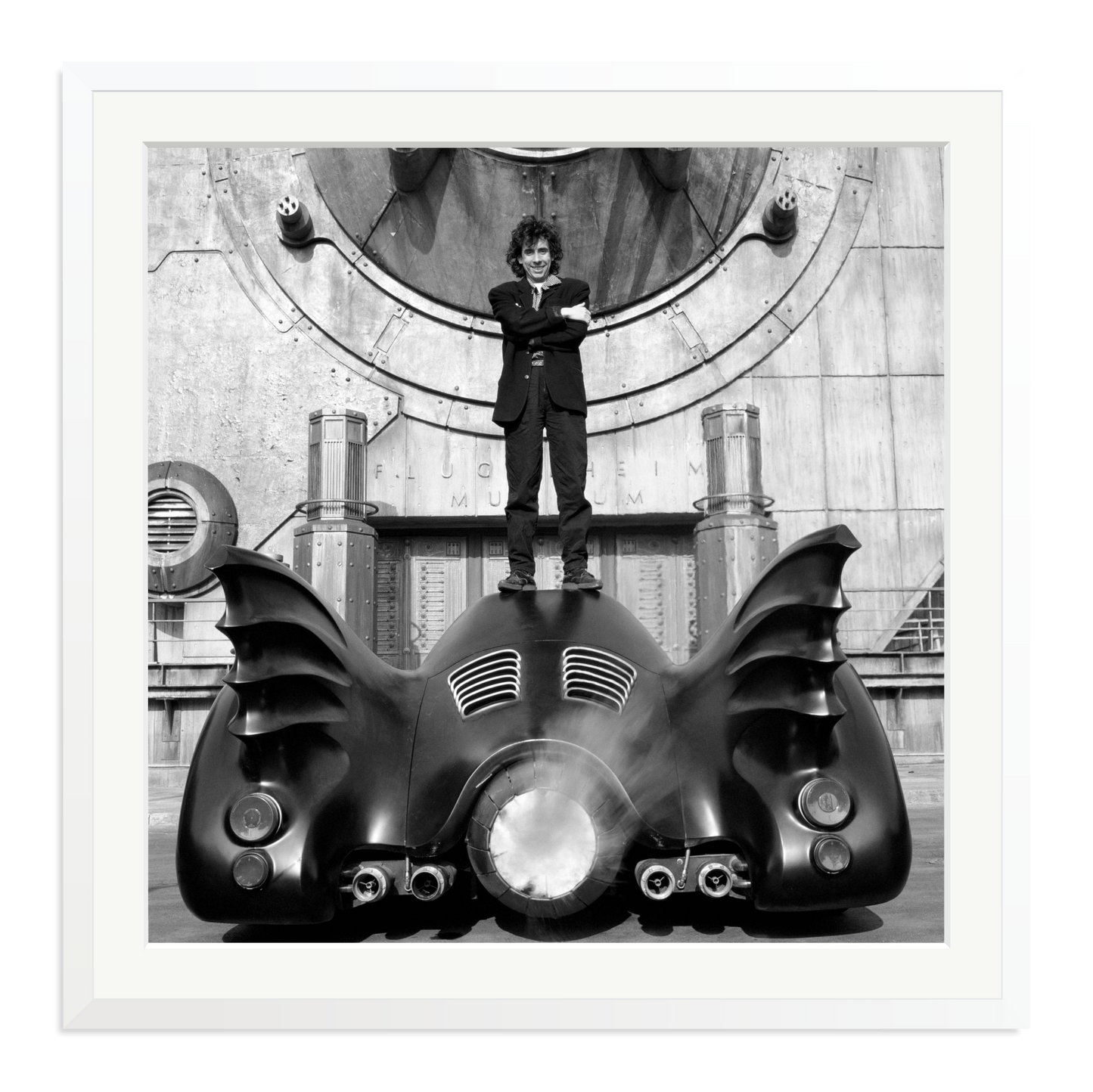 Tim Burton on The Batmobile Framed Print