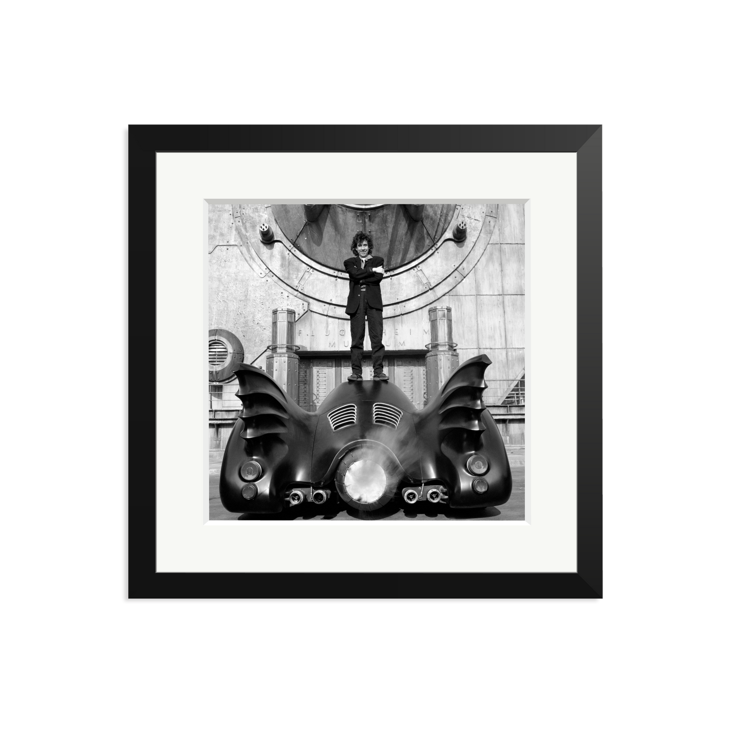 Tim Burton on The Batmobile Framed Print