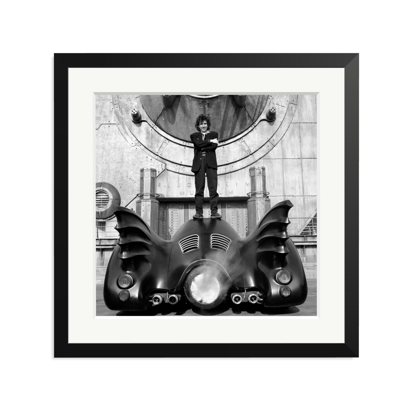 Tim Burton on The Batmobile Framed Print
