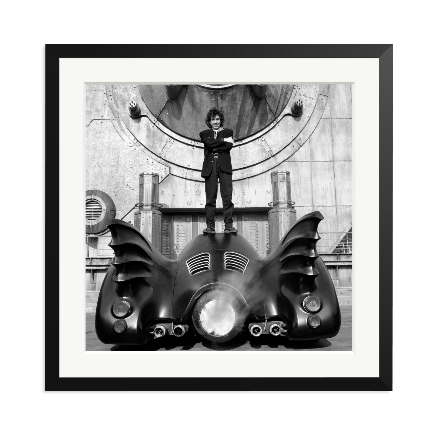 Tim Burton on The Batmobile Framed Print