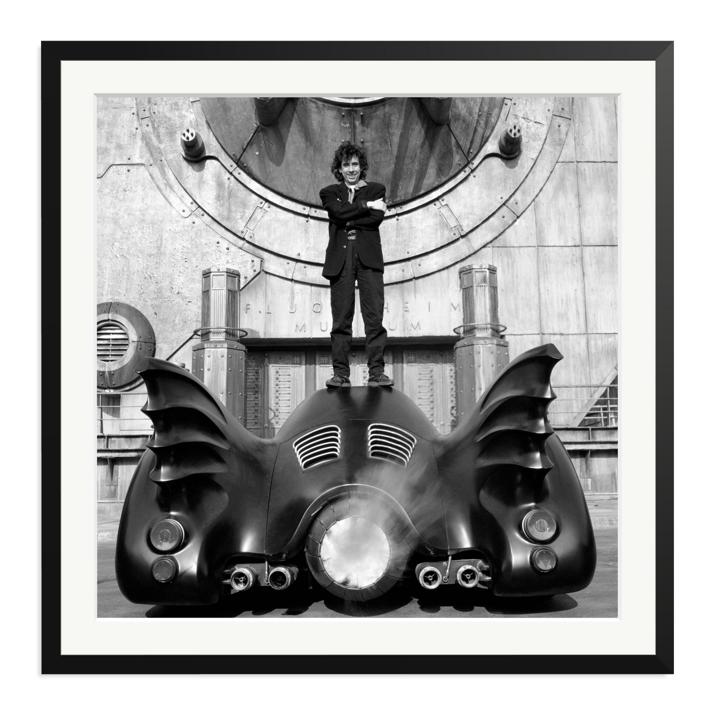 Tim Burton on The Batmobile Framed Print