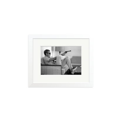 Steve McQueen Aims a Pistol Framed Print