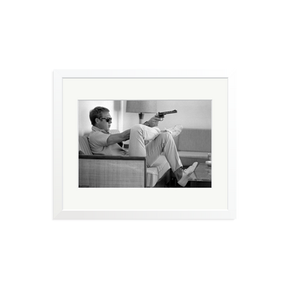 Steve McQueen Aims a Pistol Framed Print