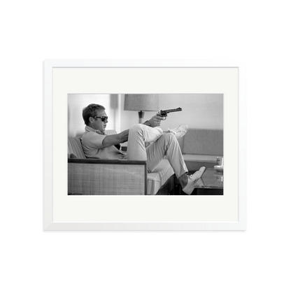 Steve McQueen Aims a Pistol Framed Print