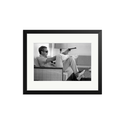 Steve McQueen Aims a Pistol Framed Print