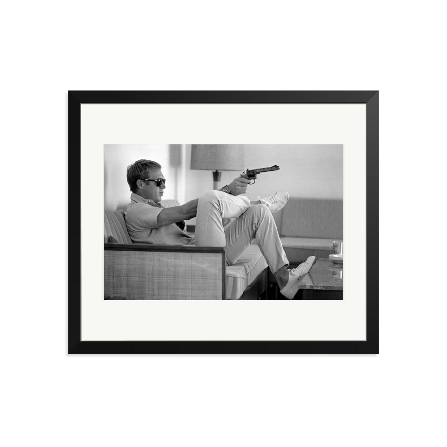 Steve McQueen Aims a Pistol Framed Print