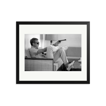 Steve McQueen Aims a Pistol Framed Print