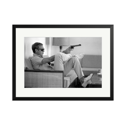 Steve McQueen Aims a Pistol Framed Print