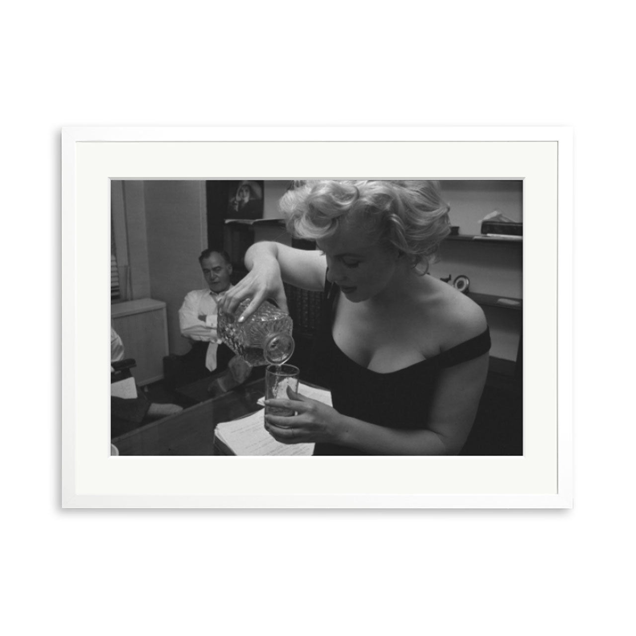 Marilyn Monroe Pouring A Drink Framed Print
